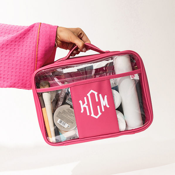 hot pink large clear toiletry case in hand