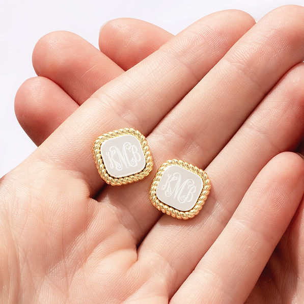 cable stud earrings in hands