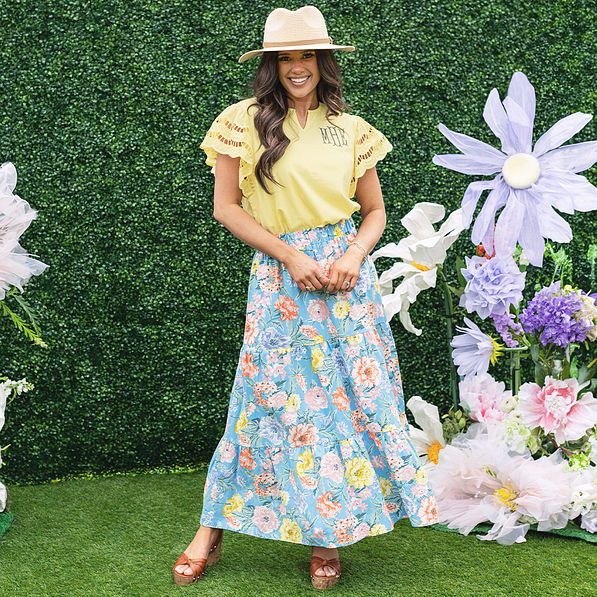 girl wearing personalized flutter sleeve top in soft yellow with flowers