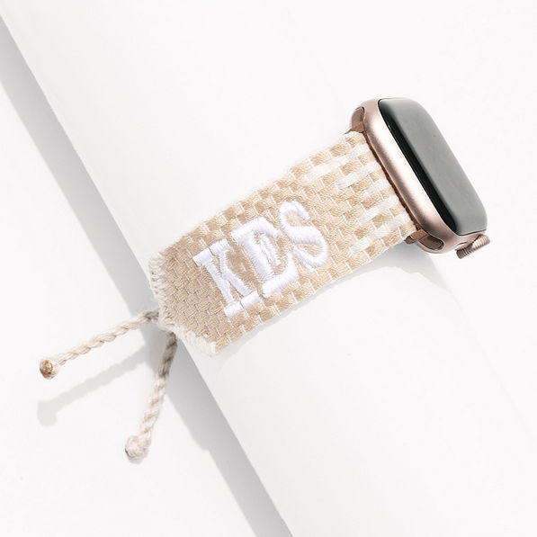 tan and white woven monogrammed apple watch band