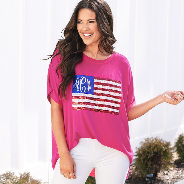 girl wearing monogrammed sequin flag t shirt in hot pink