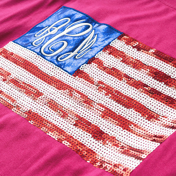close up of monogrammed hot pink sequin flag shirt
