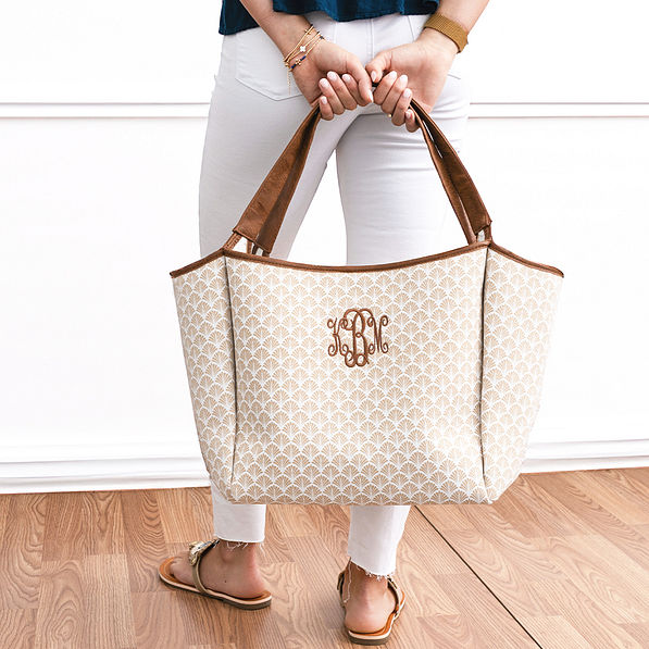 khaki shells timeless tote bag in hands