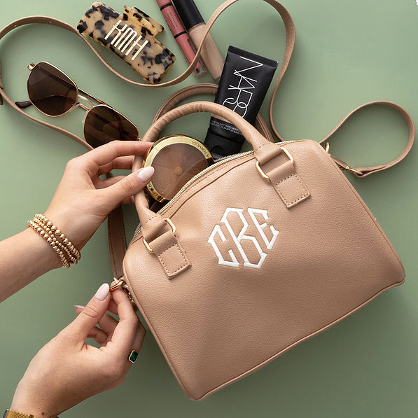 tan harper handbag spill shot with makeup