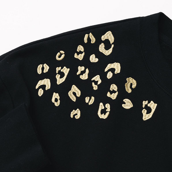close up of leopard embroidered detail on blessed sweatshirt