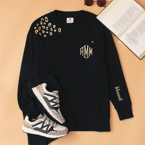 monogrammed blessed black shirt with leopard sneakers