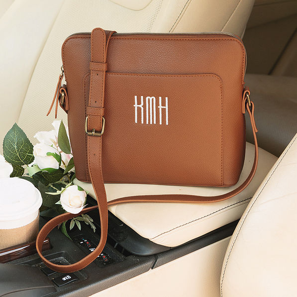 close up of monogrammed brown classic crossbody bag