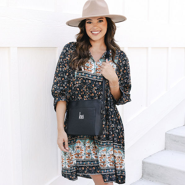 girl with black monogrammed classic crossbody over shoulder