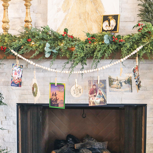 christmas cards on monogrammed photo garland on mantel