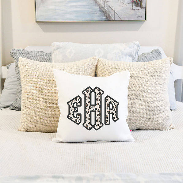 personalized pillow on bed with leopard design