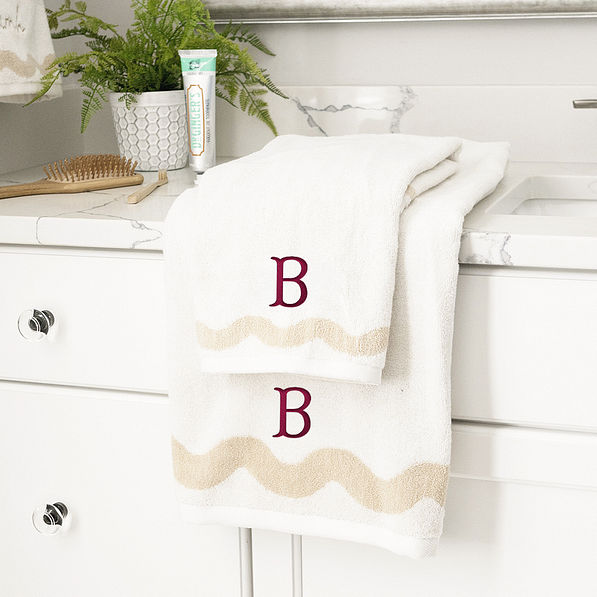 bath towel set with burgundy fishtail initial monogram