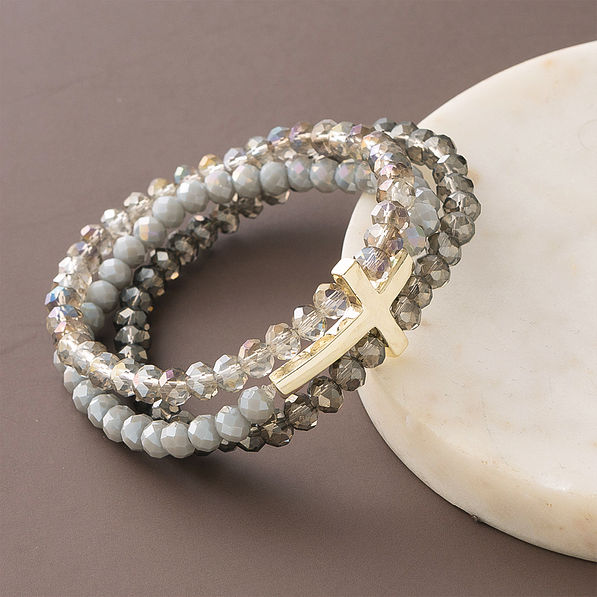 cross bracelet with marble dish on brown