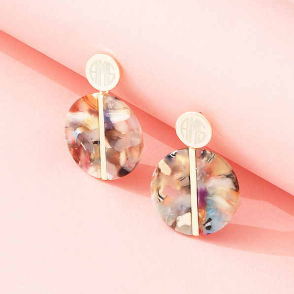 multi resin earrings on pink paper