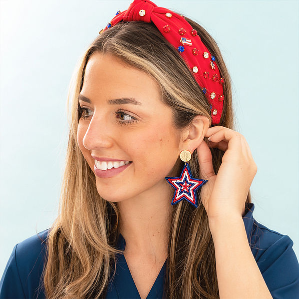americana monogrammed patriotic earrings in ear