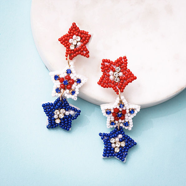 patriotic earrings on marble dish