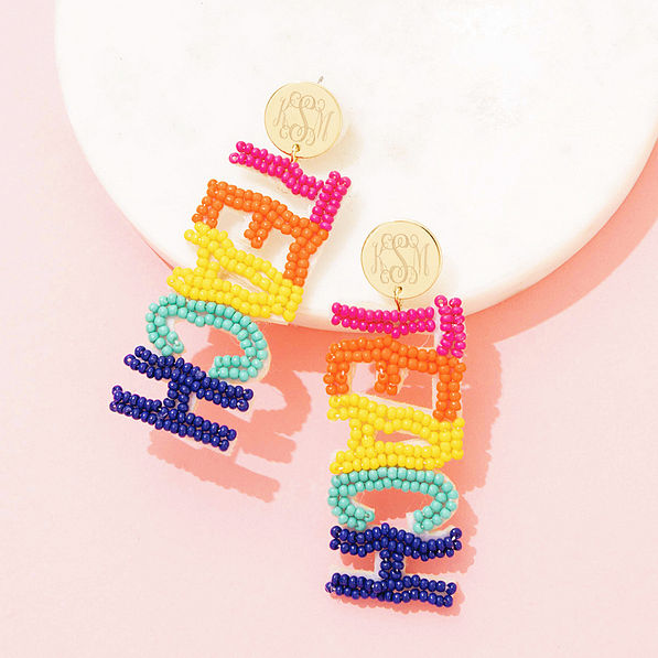 multi teacher earrings on marble dish