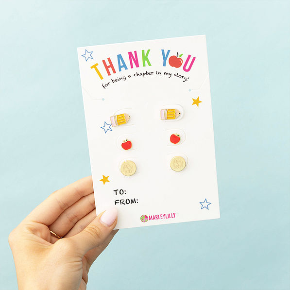 gold teacher earring set with blue background