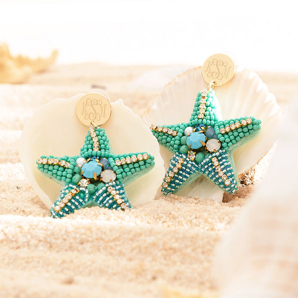 blue starfish earrings on seashells