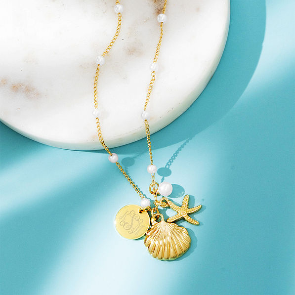 shell pearl necklace on blue paper