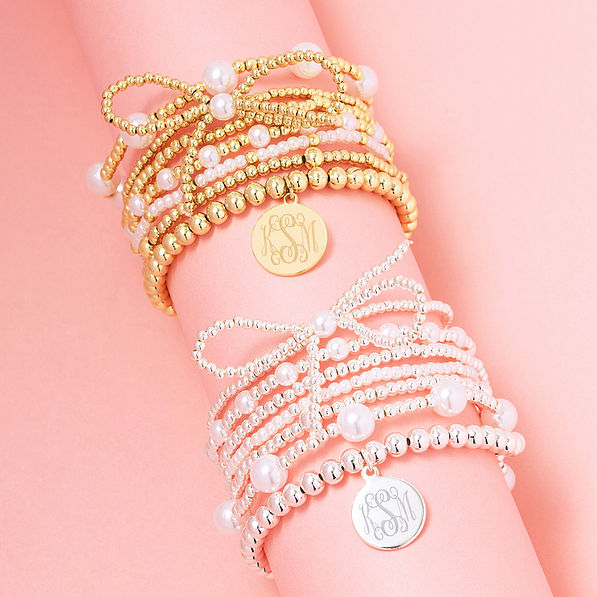 duo pearl bow bracelet stack in gold and silver