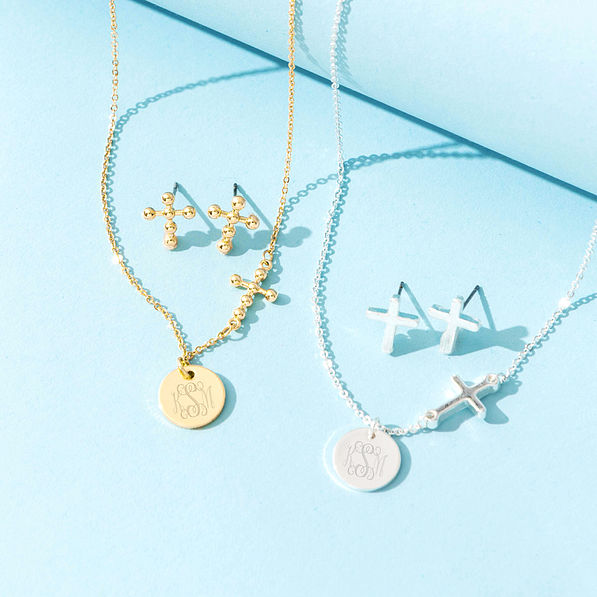 gold and silver necklace sets on blue paper
