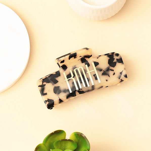 tortoise hair clip on tan background