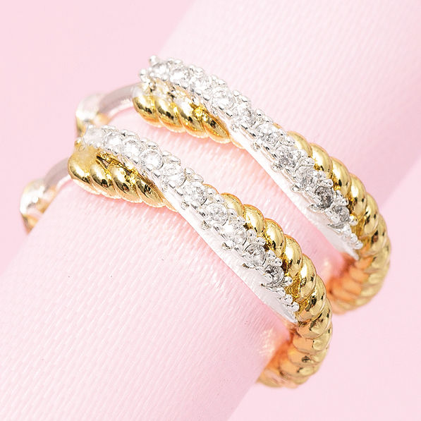 close up of silver and gold pave cable hoop earrings