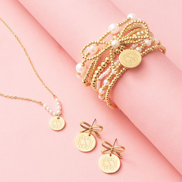 bow dangle earrings with pearl necklace and pearl bow bracelet stack