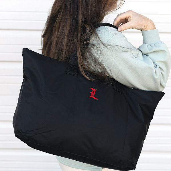 Louisville Cardinals Packable Duffel Bag on Shoulder