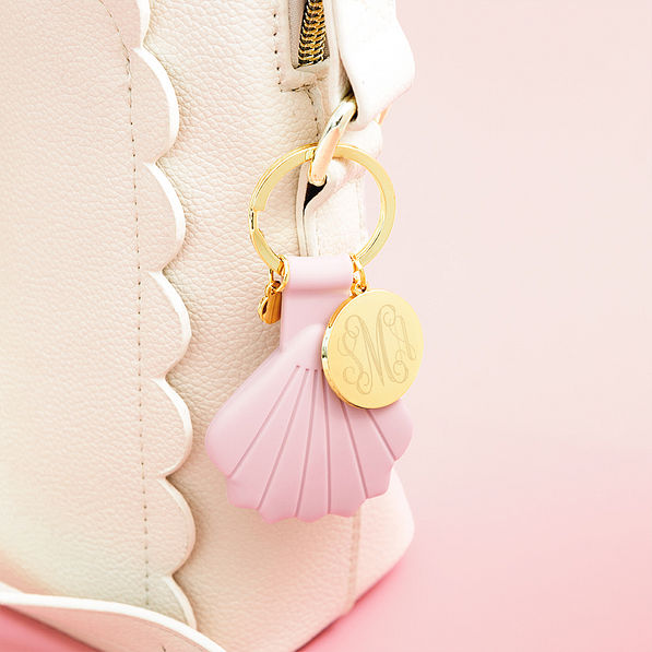 pink airtag key chain on bag