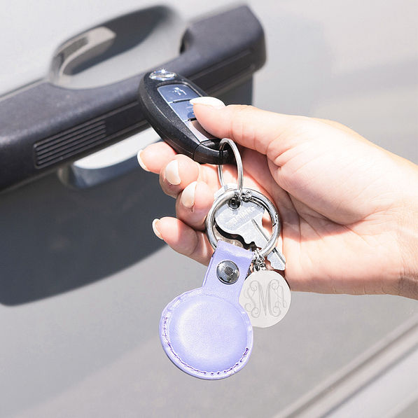 Lavender airtag keychain in hand