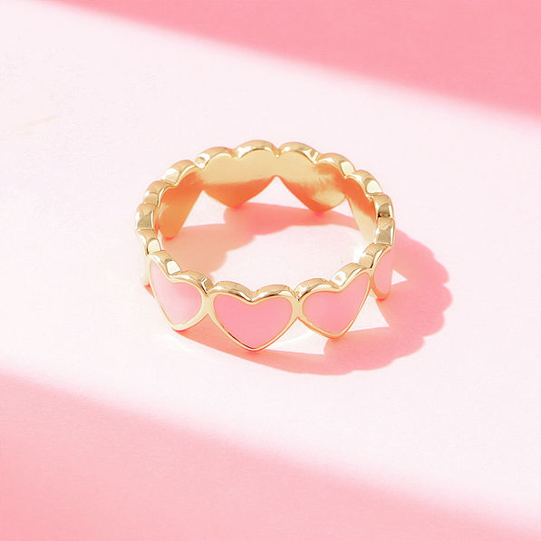heart ring on pink paper
