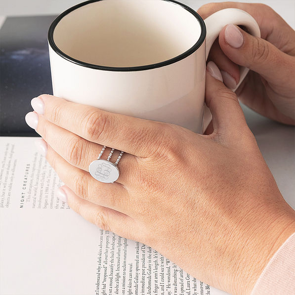 statement ring in silver and coffee mug