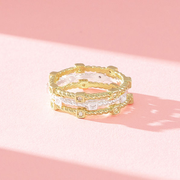 close up of silver and gold cable stack ring