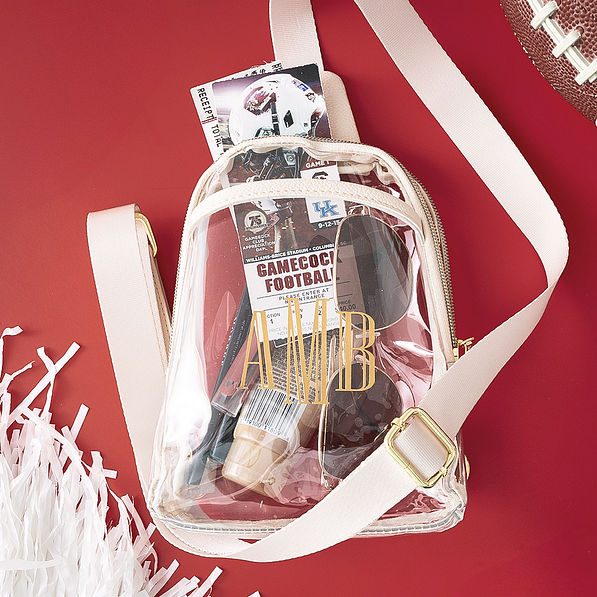 bone personalized sling bag on burgundy background