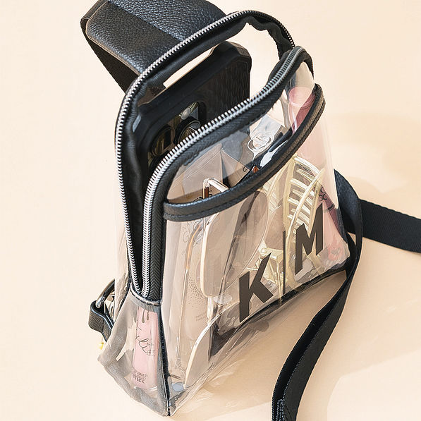inside of black monogrammed clear sling bag
