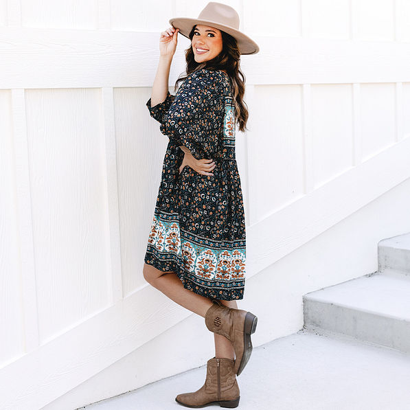 side of black paisley puff sleeve dress