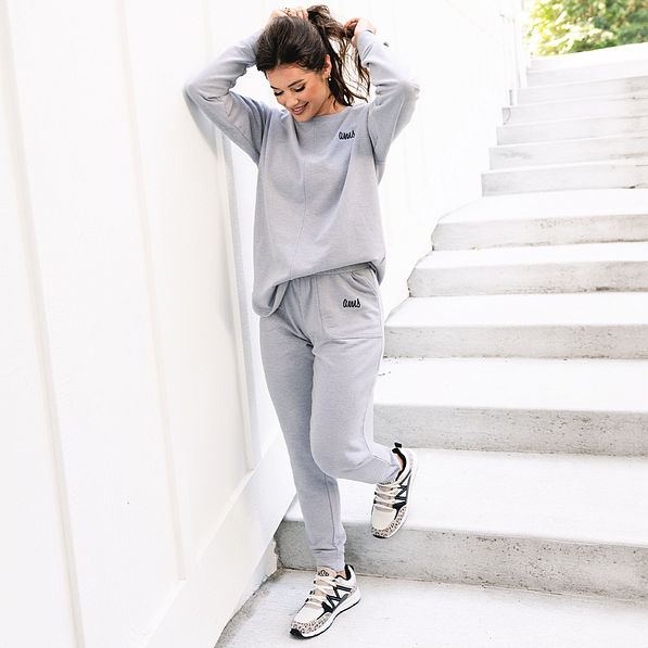 girl wearing monogrammed heathered grey joggers and sweatshirt