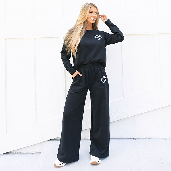 monogrammed black wide leg pants with sweatshirt