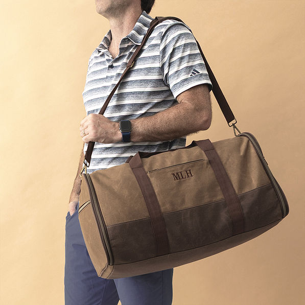 waxed canvas convertible weekend bag on shoulder
