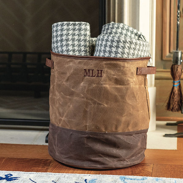 waxed canvas storage basket with blankets