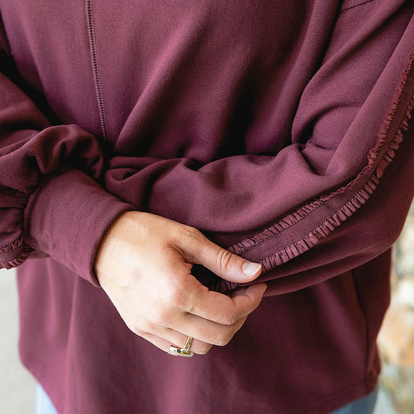 burgundy accent sleeve sweatshirt up close