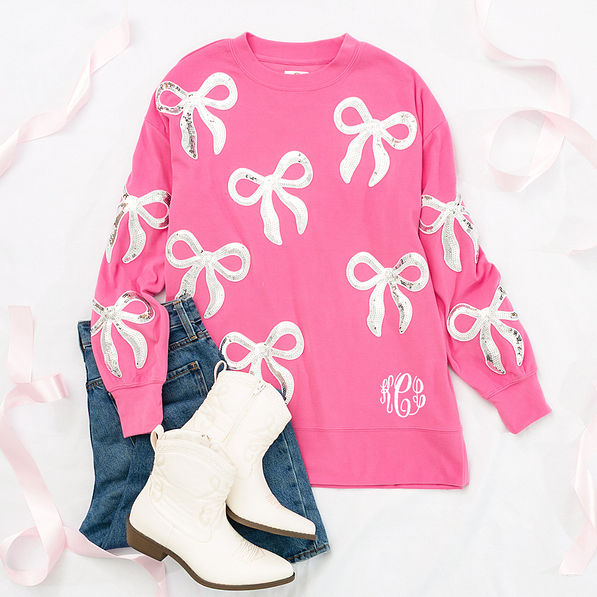 hot pink sequin bow sweatshirt flatlay