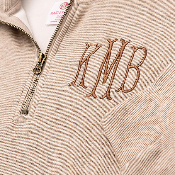 close up of tan monogrammed heathered fleece pullover