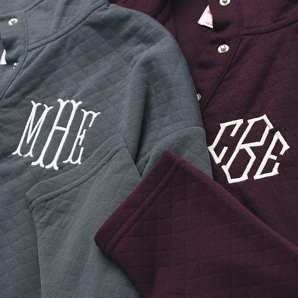 close up of charcoal and plum personalized quilted pullovers