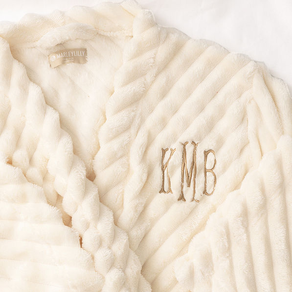 up close of monogram on plush robe