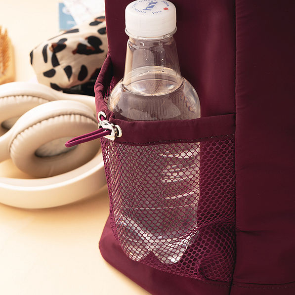 close up of water bottle in side pocket of carry on tote