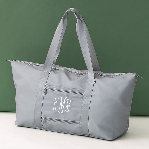 mushroom gray monogrammed carry on weekend bag on olive background