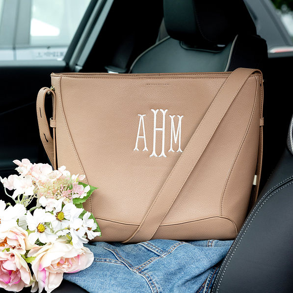 monogrammed bucket bag in car