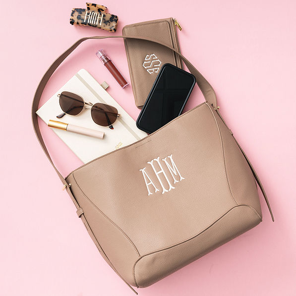 monogrammed bucket bag with accessories